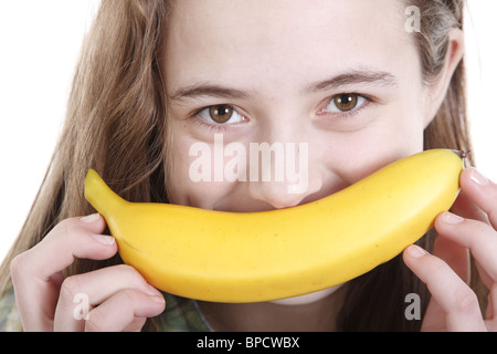 Teengirl mit einer Banane wie einen Schnurrbart Stockfoto