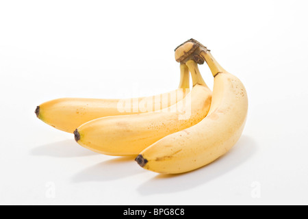 Bündel von drei reife, gelbe Bananen Stockfoto