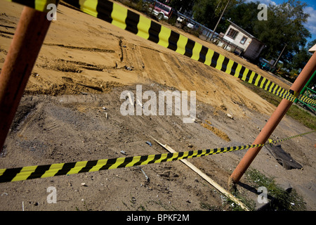 Gefahr-Linie auf der leeren Baustelle Stockfoto