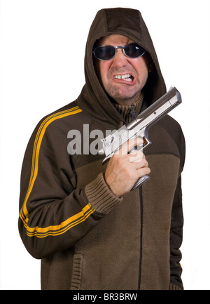 Mann in eine Kapuze mit Pistole Stockfoto