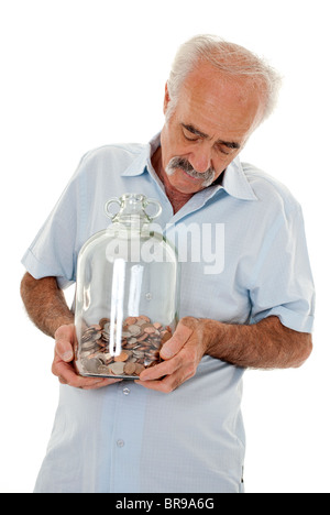 Senioren halten ein Geld-Glas Stockfoto