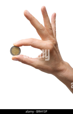 einer Hand eine Münze Stockfoto