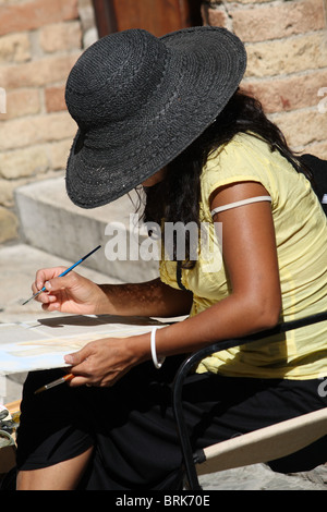 Bürgersteig Künstler Malerei lokale Szene in San Gimignano, Toskana Stockfoto