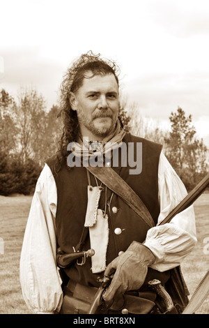 Männliche Pelz Trapper Reenactor in Sepia-Farbton Stockfoto