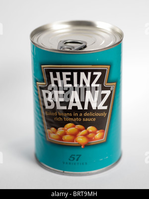 Blechdose von Heinz gebackene Bohnen Beanz handhabendem Stockfoto