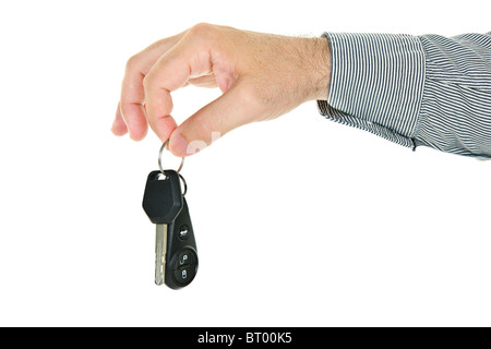 Hand, die Autoschlüssel und remote-Entry Fob isoliert auf weißem Hintergrund Stockfoto