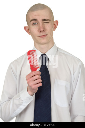 Absolut Glatzkopf mit einer Haarbürste in der hand Stockfoto