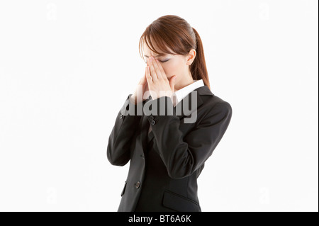 Geschäftsfrau, die unter Kopfschmerzen leiden Stockfoto