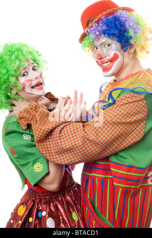 weibliche und männliche Clowns haben Spaß Stockfoto