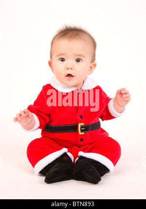 6 Monate alten Jungen in seinem Weihnachts-Outfit Stockfoto