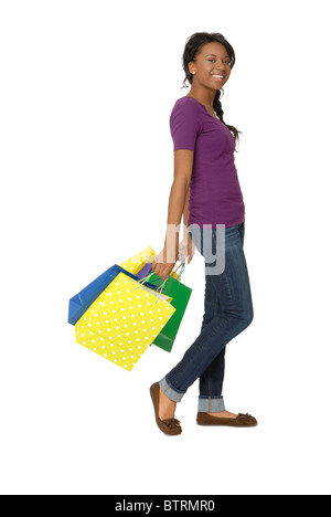 Teenager-Mädchen mit bunten Einkaufstüten. Stockfoto