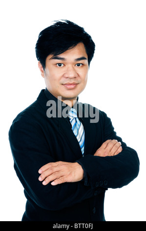 Gut aussehend Geschäftsmann mit verschränkten Armen Stockfoto