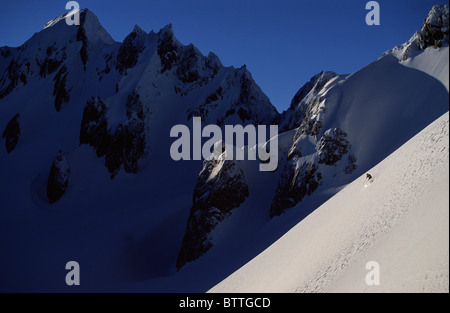 Skifahrer absteigend einen Berghang, Frans Joseph Glacier, Neuseeland Stockfoto