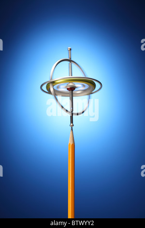 Eine Spinnerei Metall Kreisel an der Spitze der geschärften gelben Bleistift. Stockfoto