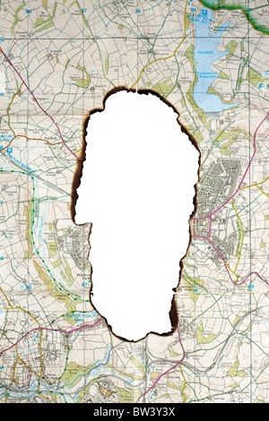 Verbrannten Loch in einer alten Ordnance Survey map Stockfoto
