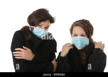 Ein glamouröses Modell trägt eine Maske, um die "Schweinegrippe" Infektion zu verhindern. Isoliert Stockfoto