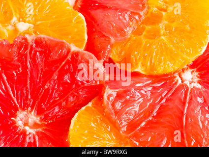 Frische Grapefruit und Orangenscheiben Hintergrund. Nahaufnahme Makro erschossen. Stockfoto