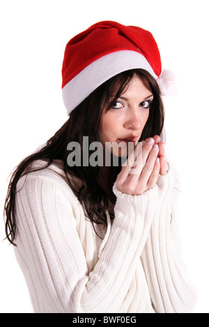 Ein Einfrieren Mädchen mit einem Weihnachts-Mütze. Alle isoliert auf weißem Hintergrund. Stockfoto