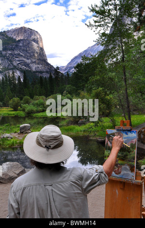 Ein Künstler malt ein Ölgemälde von Mirror Lake, Yosemite-Nationalpark, Kalifornien USA Stockfoto