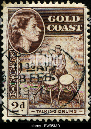 GOLDKÜSTE - ca. 1952: Eine Briefmarke gedruckt König George VI Trommeln bildhafte sprechen in Gold Coast, ca. 1952 Stockfoto