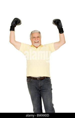 älterer Mann mit Boxhandschuhen Stockfoto