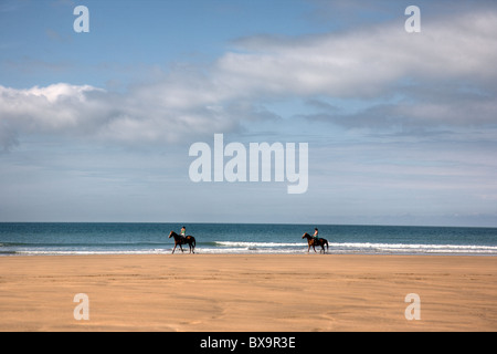 Reiter am Strand Stockfoto