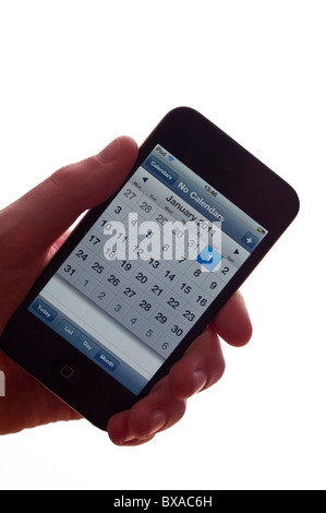 Der neue Apple Ipod touch 4. Generation 4G 32gb Mediaplayer mit Kalender mit neuen Jahren Day 2011 auf einem weißen Hintergrund Stockfoto