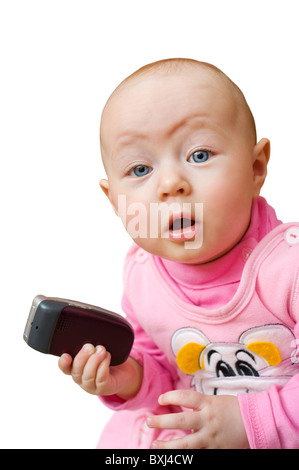 kleine europäische überrascht Babymädchen hält Handy, isoliert Stockfoto