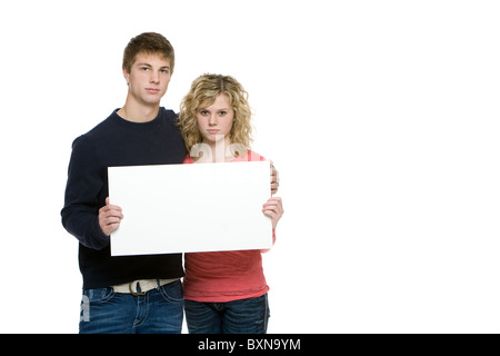 Attraktive Teenager mit leere Schild isoliert auf weiss Stockfoto