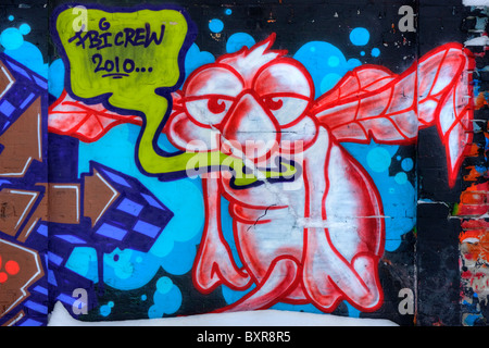 Außerirdisches Alien Graffiti an der Wand Stockfoto