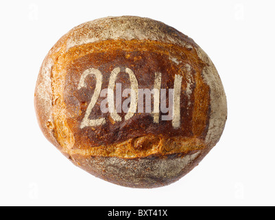 rundes Laib Brot bestäubt mit dem Jahr 2011 Stockfoto