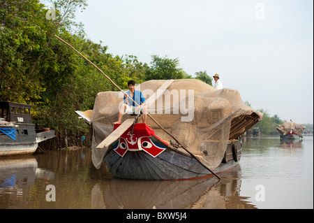 Boote, die Transport von Reis in die Kanäle rund um Vinh Long, Mekong-Delta, Vietnam Stockfoto