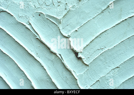 Textur mit weißen Zement und Gips-Bas-Relief Linien und Spachtel Stockfoto