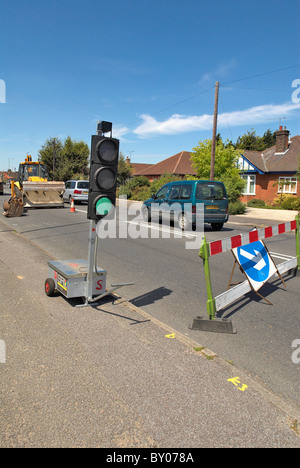 Temporäre Ampel zeigt grün UK Stockfoto