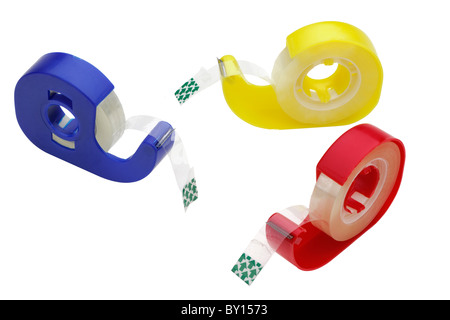 Drei gemischte farbigen Kunststoff Klebebandspender Stockfoto