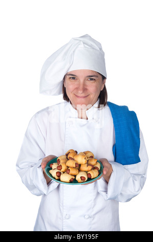 Eine Köchin zeigt ihre letzte Mahlzeit. Isoliert auf weiss für Designer Komfort. Stockfoto