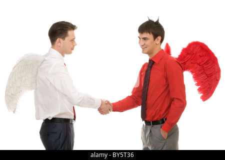 Handschlag von Gott und Teufel isoliert auf weißem Hintergrund Stockfoto