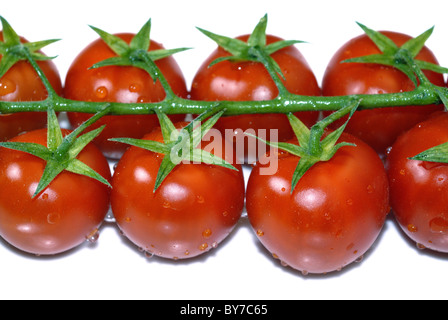 Cherry-Tomaten, die isoliert auf einem weißen Stockfoto
