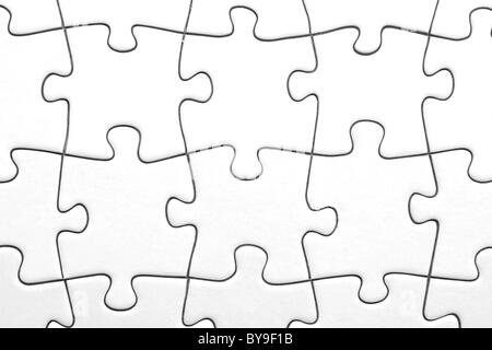 Weiße Jigsaw Puzzle-Teile Stockfoto