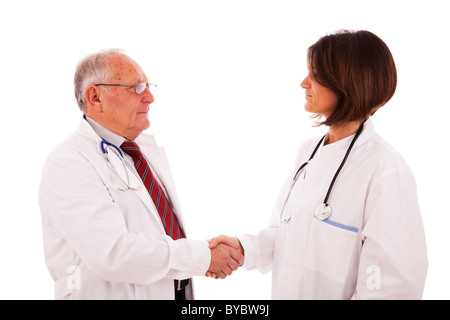 Handshake aus einem Team von Ärzten (isoliert auf weiss) Stockfoto