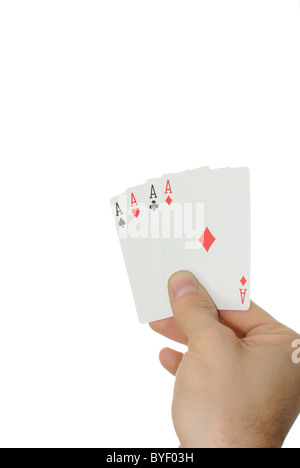 Vier Asse in der Hand isoliert auf einem weißen Hintergrund. Stockfoto