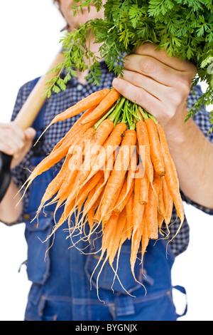 Studioaufnahme Bauern halten Karotten Stockfoto