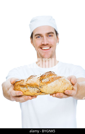 Studioaufnahme von Baker, die holding Brot Stockfoto