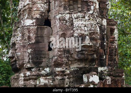 Stein-Skulptur, Gesicht des Bodhisattva Lokeshvara auf einem monumentalen Turm im Ta Som buddhistische Tempel, Siem Reap, Kambodscha, Stockfoto