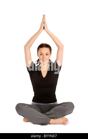 Hübsche junge Frau praktizieren Yoga Asana, isoliert auf weißem Hintergrund sitzen Stockfoto