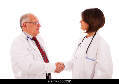 Handshake aus einem Team von Ärzten (isoliert auf weiss) Stockfoto