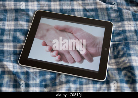 IPad, handshake Stockfoto