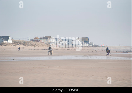 Reiten am Camber Sands sussex Stockfoto