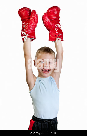 Ein Junge, 7 Jahre alt, mit Boxhandschuhe, Prost, Victor, Sieg Stockfoto