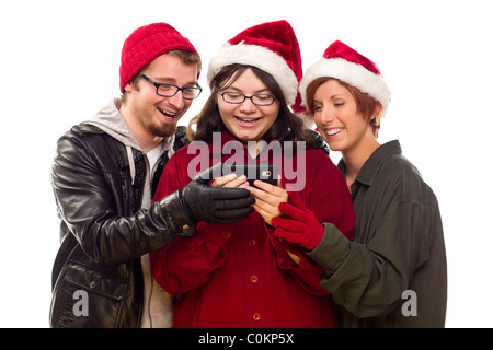 Festliche Freunde genießen ein Handy zusammen auf einem weißen Hintergrund isoliert. Stockfoto